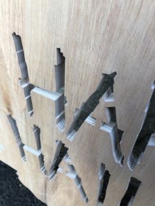 close up of waterjet cut 18mm thick ply wood